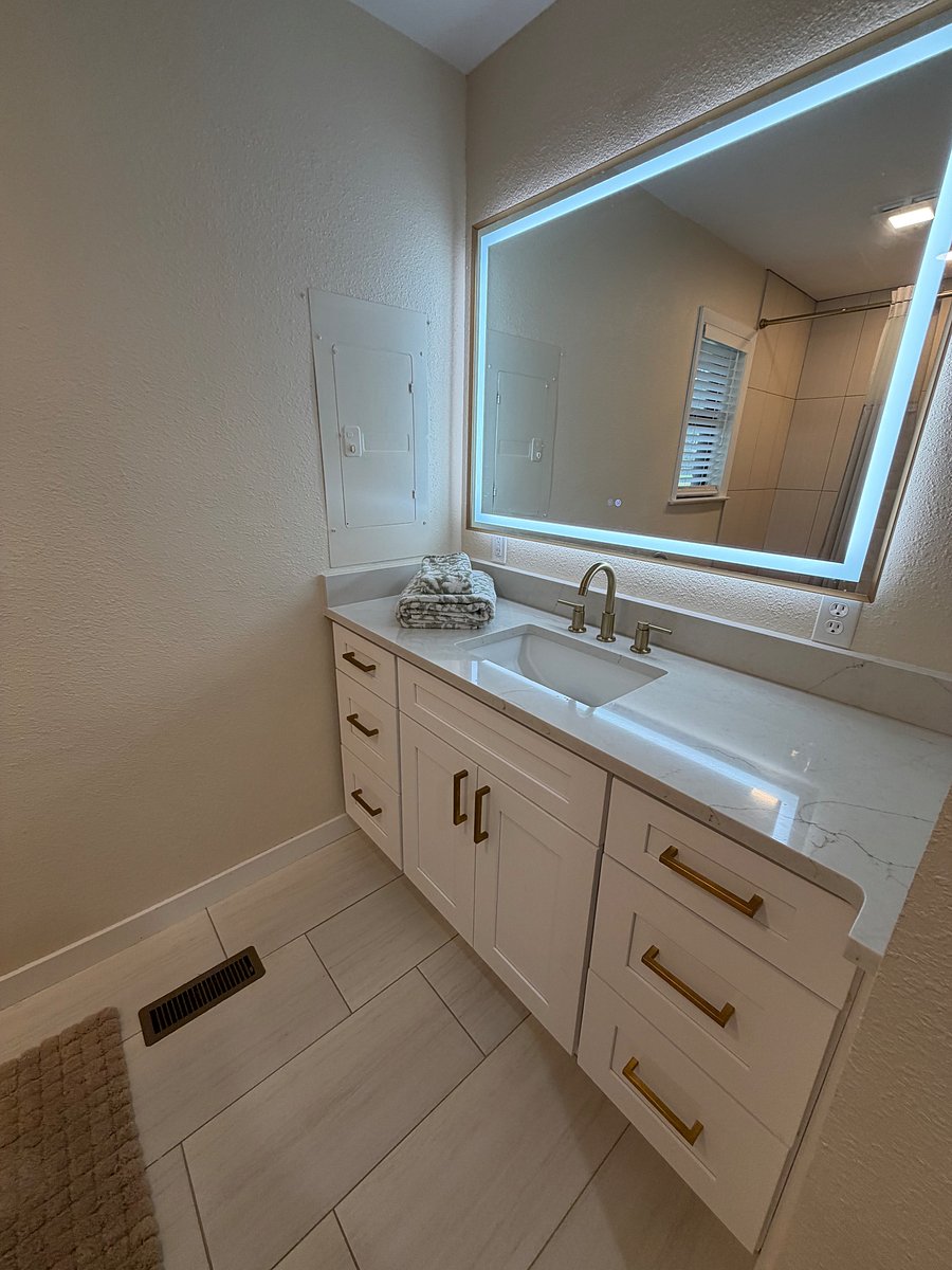 Mater bathroom feature smart mirror with adjustable lighting and defrost mirror