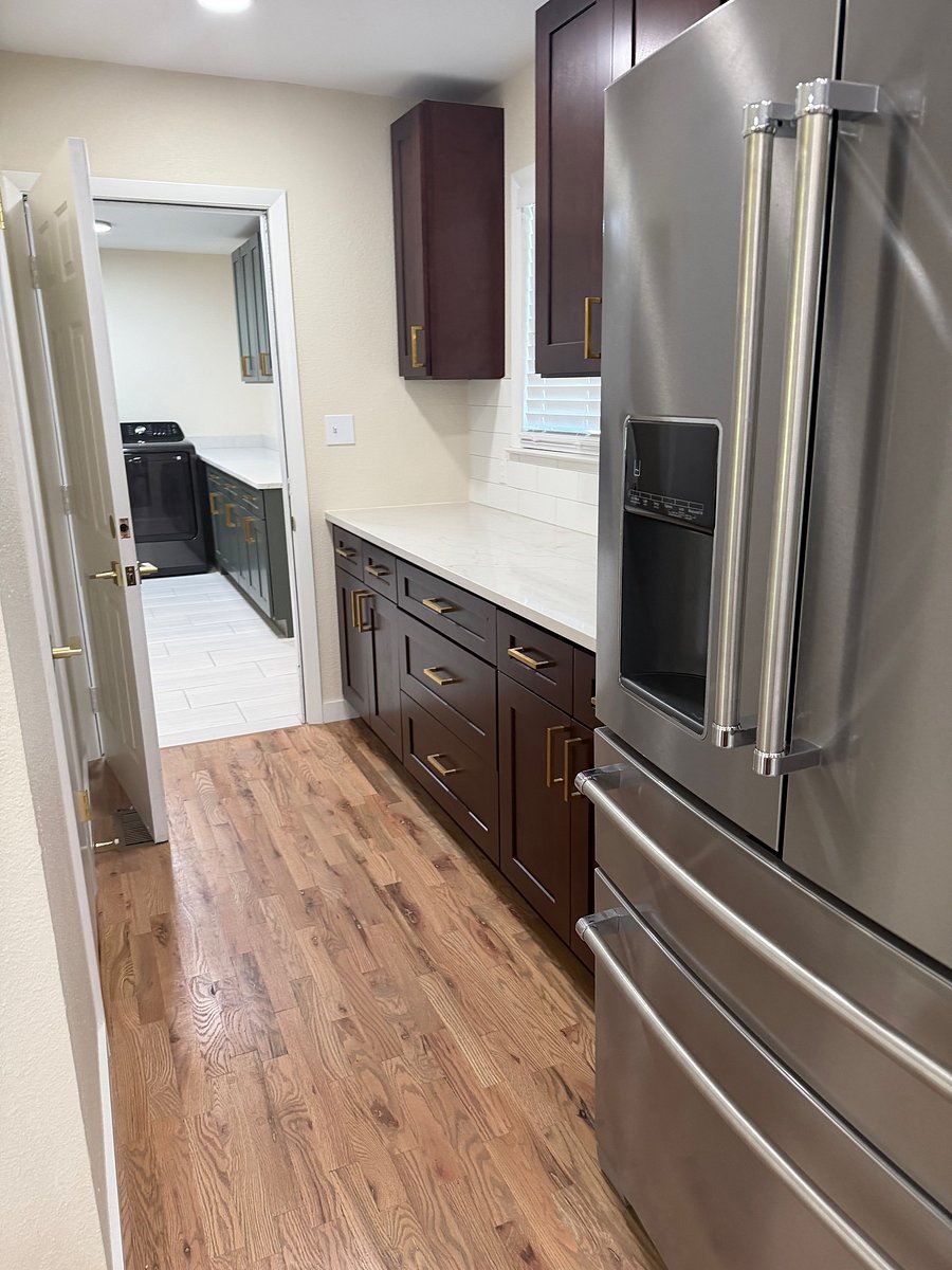 More counter and cabinet space leading to the laundry room