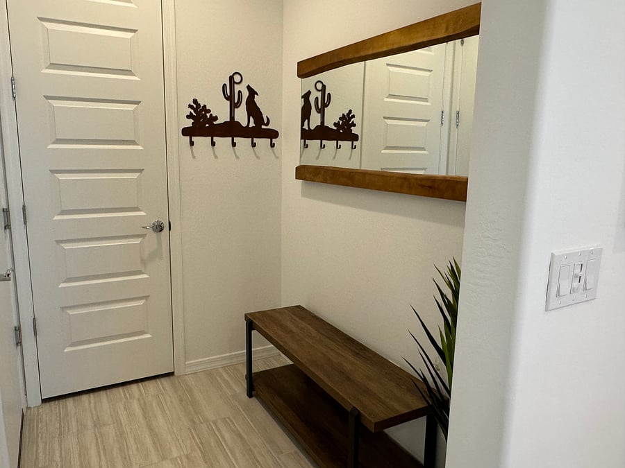 Garage entrance to the left out of view- linen/storage closet ahead on left and bench for shoes etc at entrance from garage.