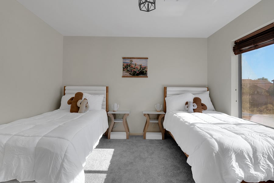 Bright, comfortable room with two beds-ideal for families or group stays. Bedside tables have USB/USB-C ports.
