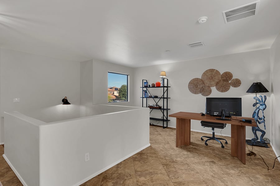 Flexible upstairs space perfect for work, reading, or extra lounging.