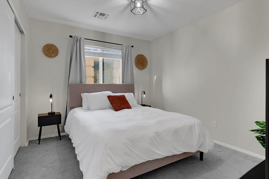 Unwind and recharge in this peaceful bedroom with everything you need for a great night's rest. Each bedroom has lamps, tables, and hangers.