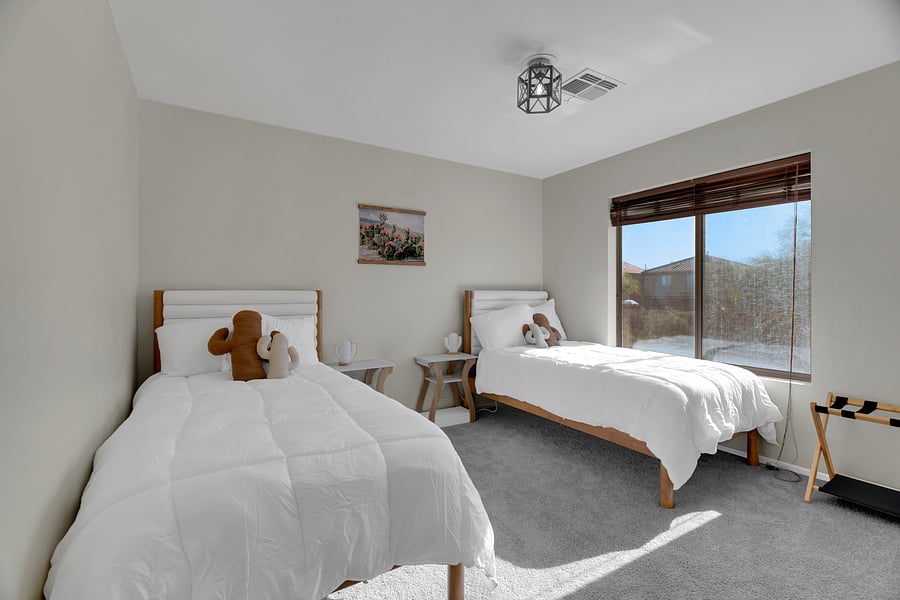 Twin beds with soft linens-perfect for friends, kids, or flexible sleeping arrangements.