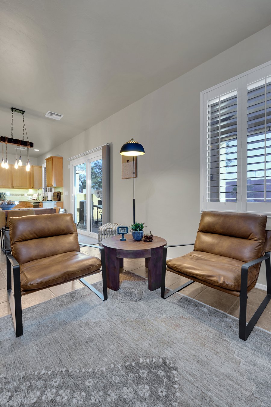 Comfort meets modern design in this inviting reading nook, with natural light and views toward the backyard grill.