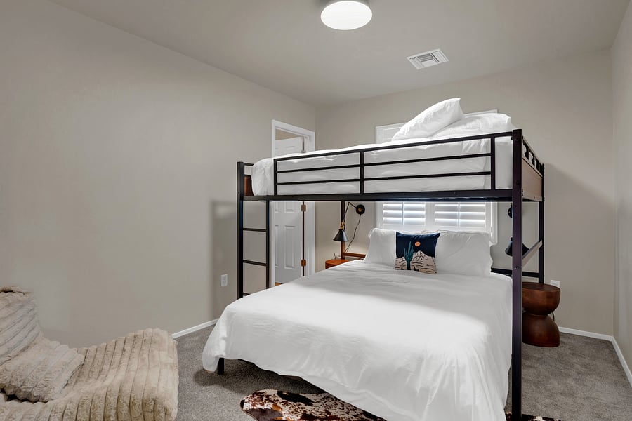The ultimate bunk room! A queen-over-queen loft bunk sleeps the whole crew, plus a plush lounge chair for kids and teens.