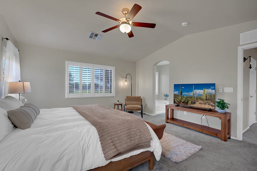 Spacious and serene, with a king bed, large smart TV, and a private ensuite just through the arch.