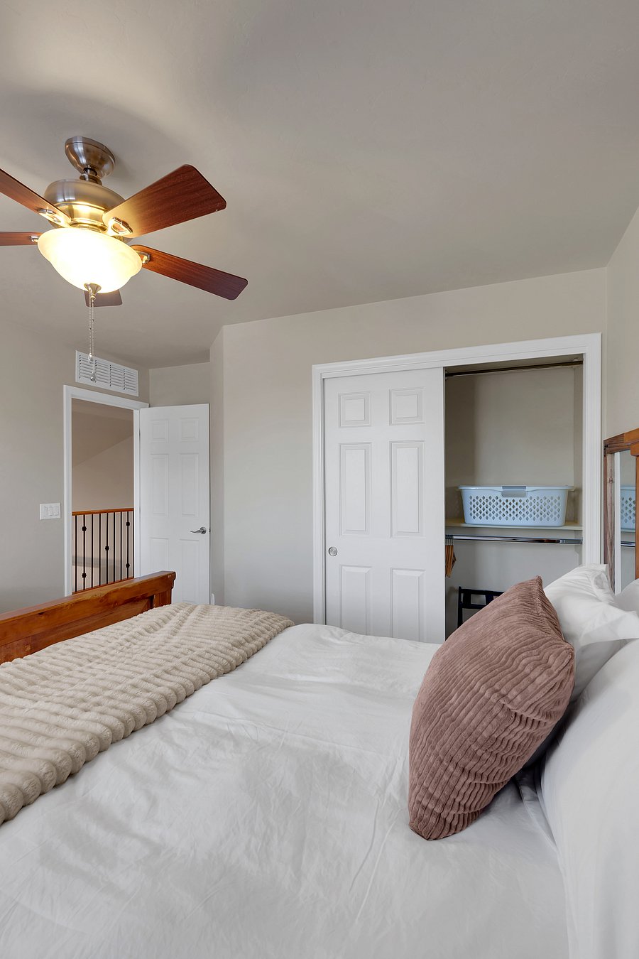 Plenty of room to unpack, with a closet, luggage rack, and laundry basket ready for your stay.
