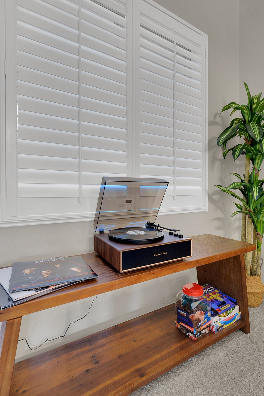 Spin your favorite vinyl on the Crosley record player, with classic albums and family board games ready to enjoy.