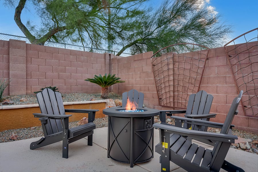 Gather around the glow: a cozy fire pit with comfy Adirondack seating, made for s'mores, stories, and starry desert nights.