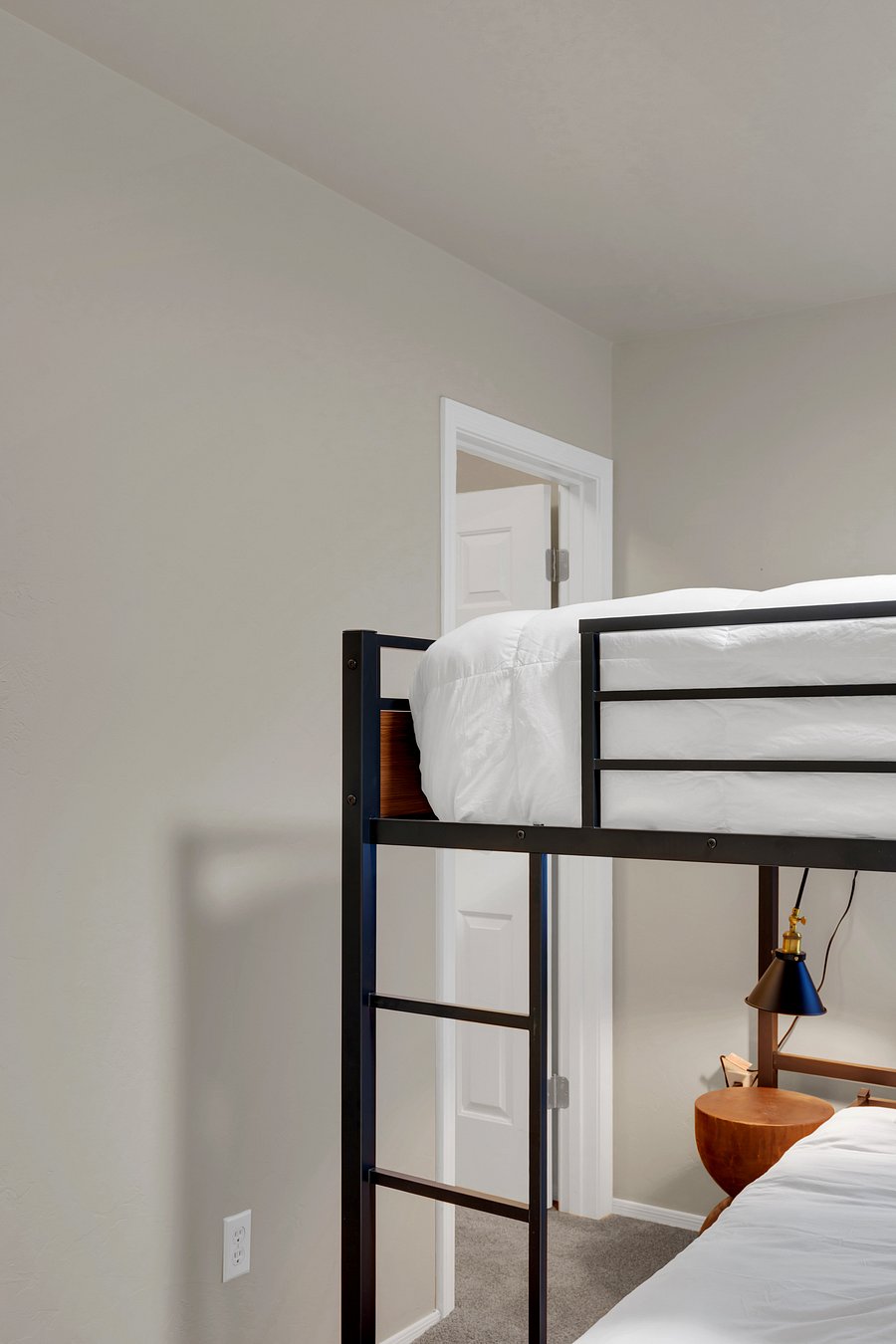 Modern industrial design with two full queen beds, perfect for siblings, cousins, or friends.