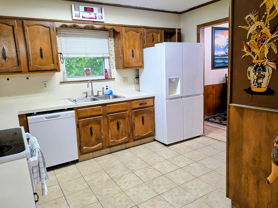 Kitchen with refrigerator, dishwasher and sink. All kitchen essentials are provided.