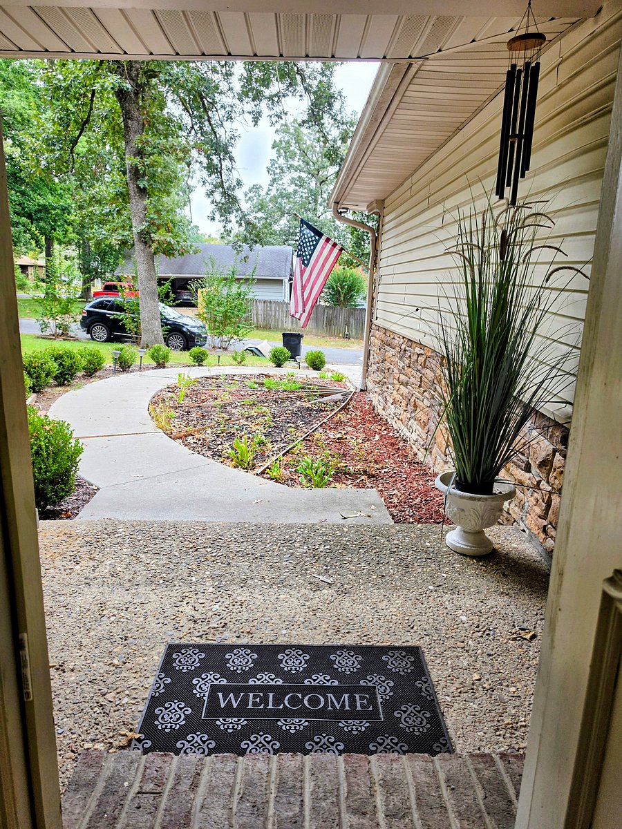 Covered entry with landscaped walkway