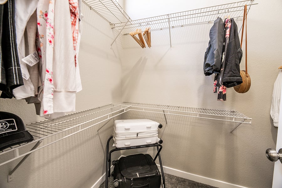walk in closet in the primary bedroom