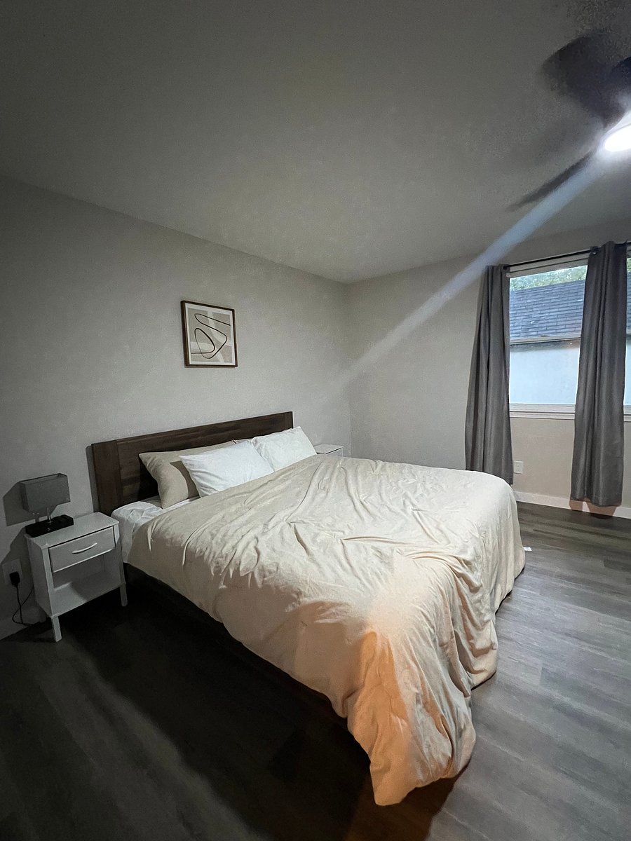 Separate bedroom with King sized bed, blackout curtains, 2 side tables.

Not pictured on other side of bedroom room: Desk/chair, dresser/storage, closet