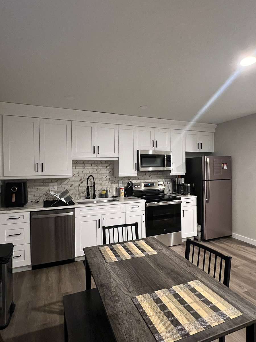 Fully stocked kitchen with dining table