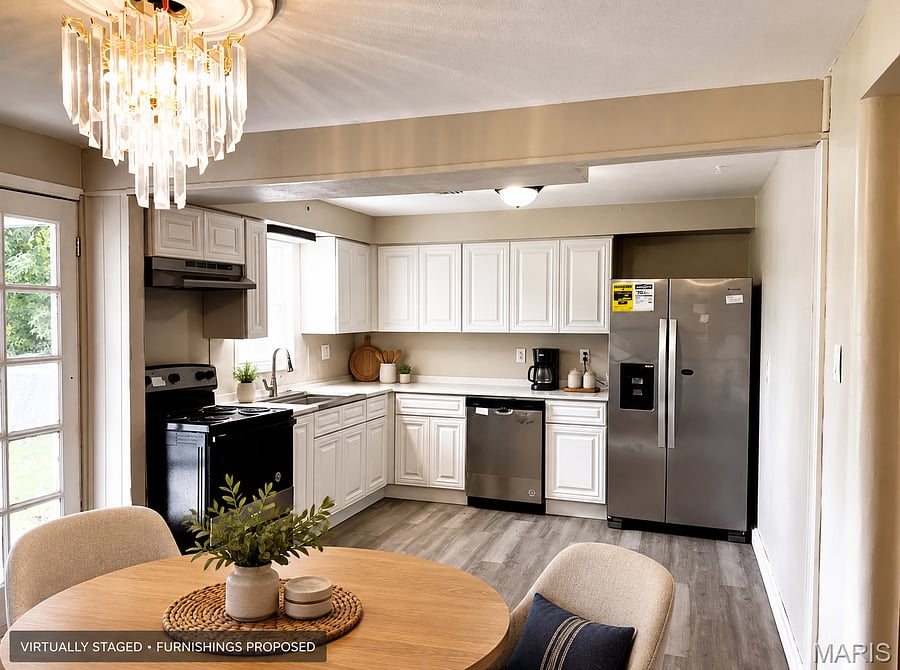 Kitchen and dining - VIRTUALLY STAGED. Dining furniture and countertop decor are proposed, not confirmed installed.