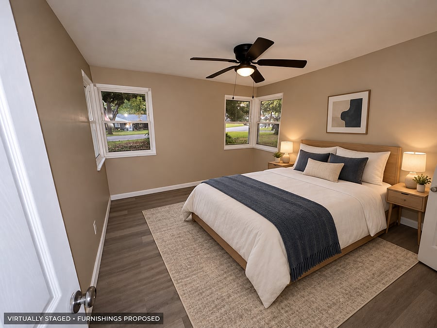 Corner bedroom - VIRTUALLY STAGED. Furniture and decor are proposed, not confirmed installed. Final bed size and setup are being completed.