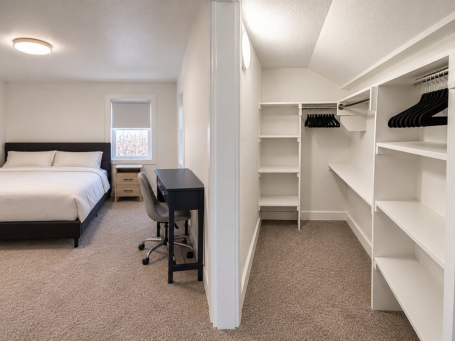 Large closet to the master bedSpacious walk-in closet in the primary bedroom with ample shelving, hanging space, hangers, and an iron and ironing board for your convenience.