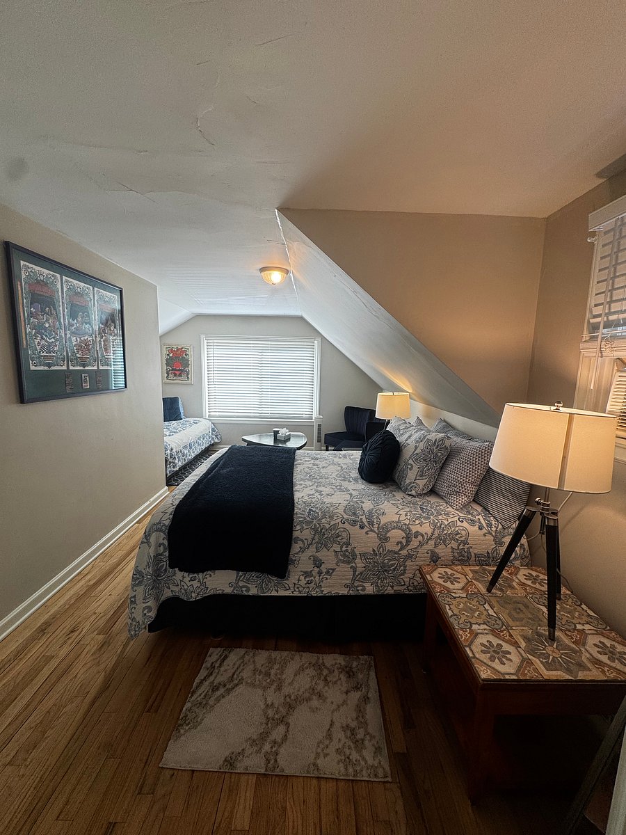 What a long, strange trip it's been! Kick back and drift into sweet dreams in this cozy queen bed, dressed in beautiful blue and white bedding. (upstairs bedroom)