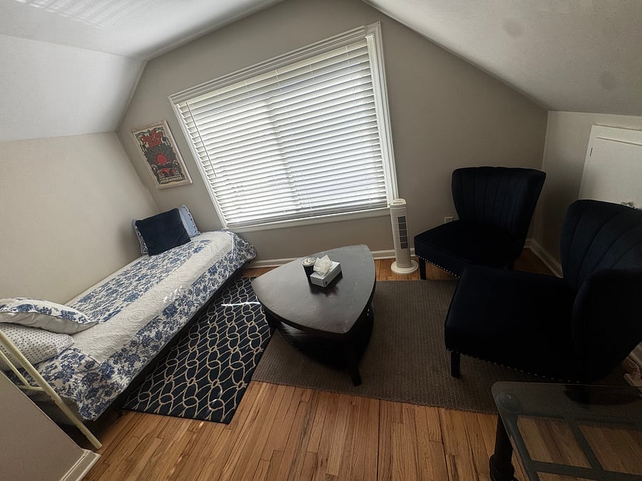 This groovy little lounge features two beautiful navy blue chairs and a coffee table, creating the perfect spot to sip your morning brew, share stories with your traveling companions, or simply let the good times roll. (upstairs bedroom)