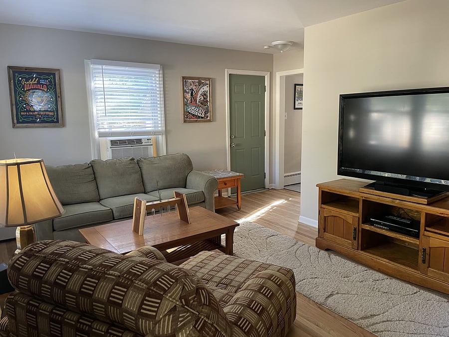 Come on in, kick off your shoes, and stay awhile! Our laid-back living room is made for good company, easy conversations, and a little peace, love, and relaxation. Stretch out on the comfy sofa, or sink into the oversized armchair with matching ottoman.