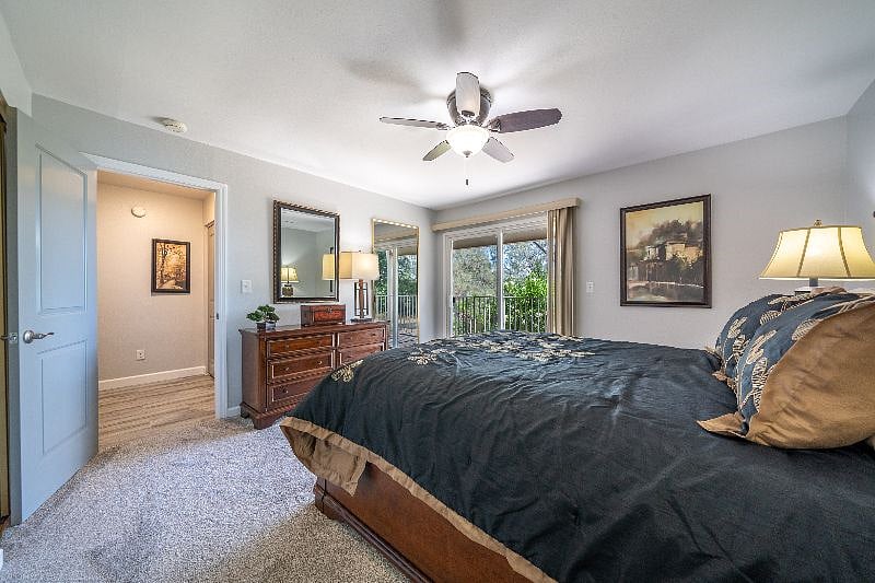 Master Bedroom with walk in closet behind mirror door