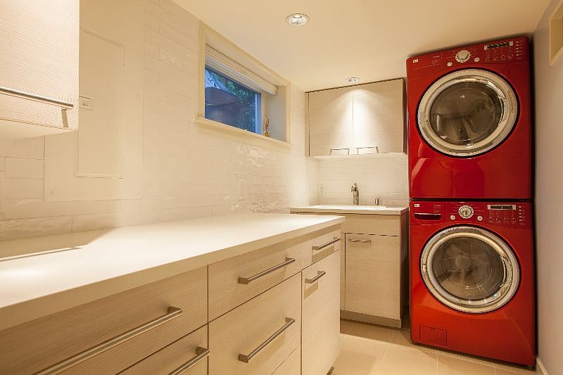 Newly updated laundry area with quartz counters.