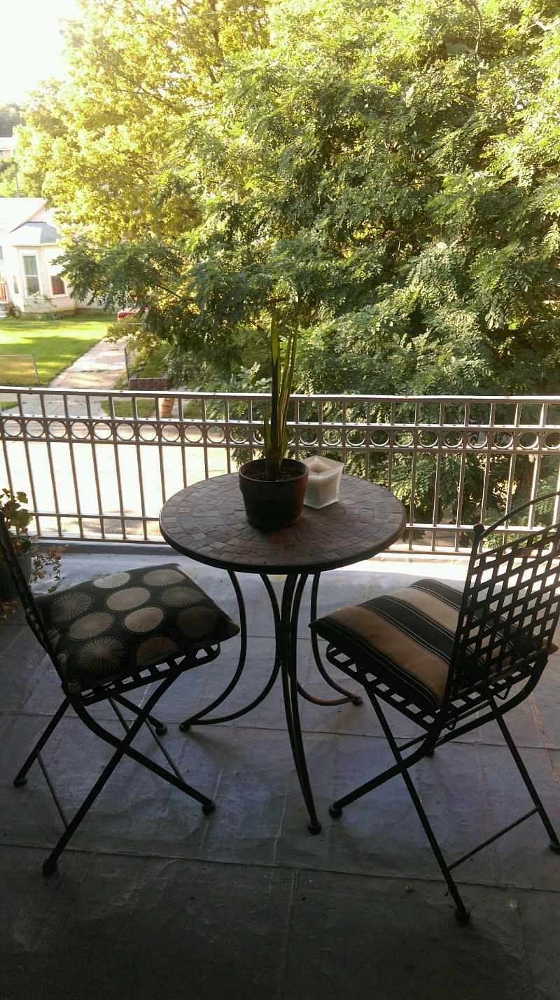 sweet balcony with a bistro set