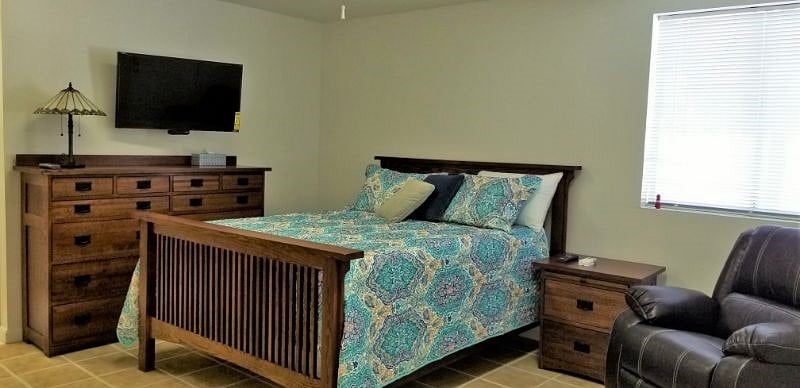 Bed, dresser, recliner, TV