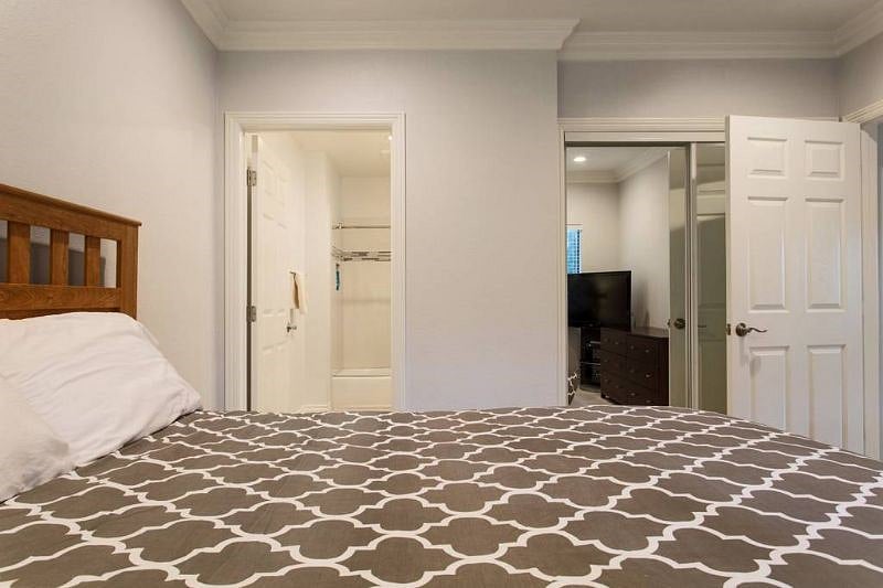 Master bedroom leading to private bathroom