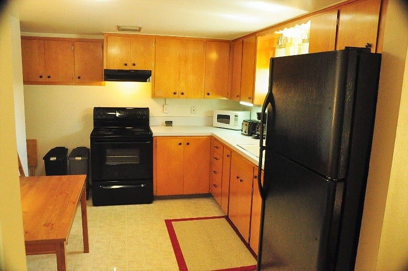 Lots of kitchen storage space and cooking utensils. No dishwasher. Brita filter for water. Electric stove and oven. Full fridge.