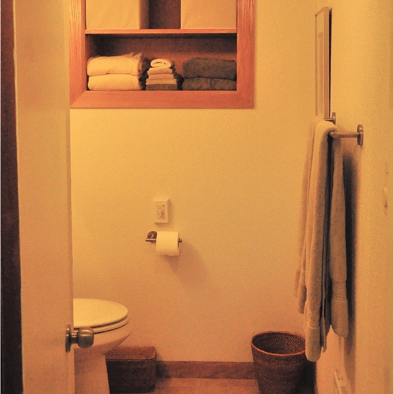 View of bathroom from hall. Shower on left.