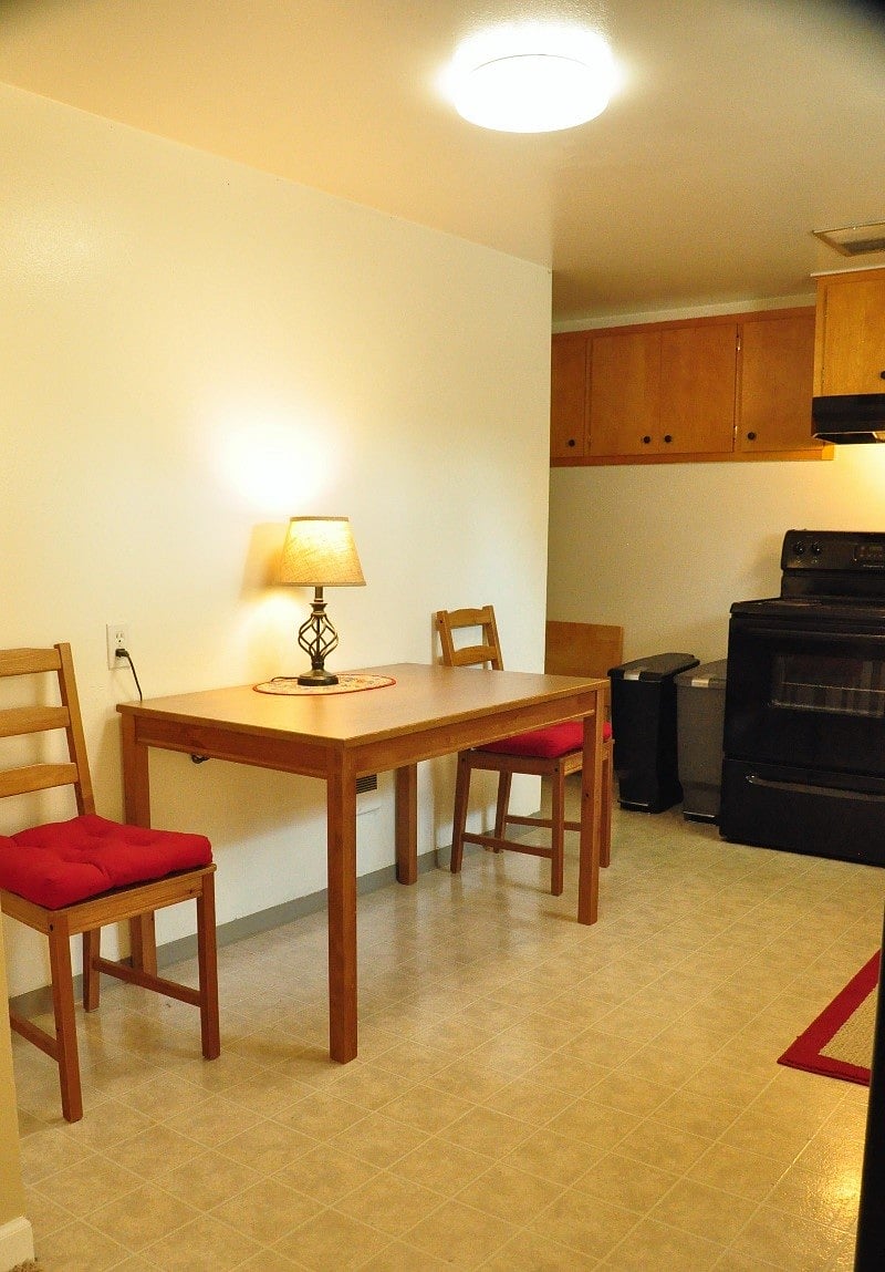 Full dining for four (two other red seats found nearby in living room). 