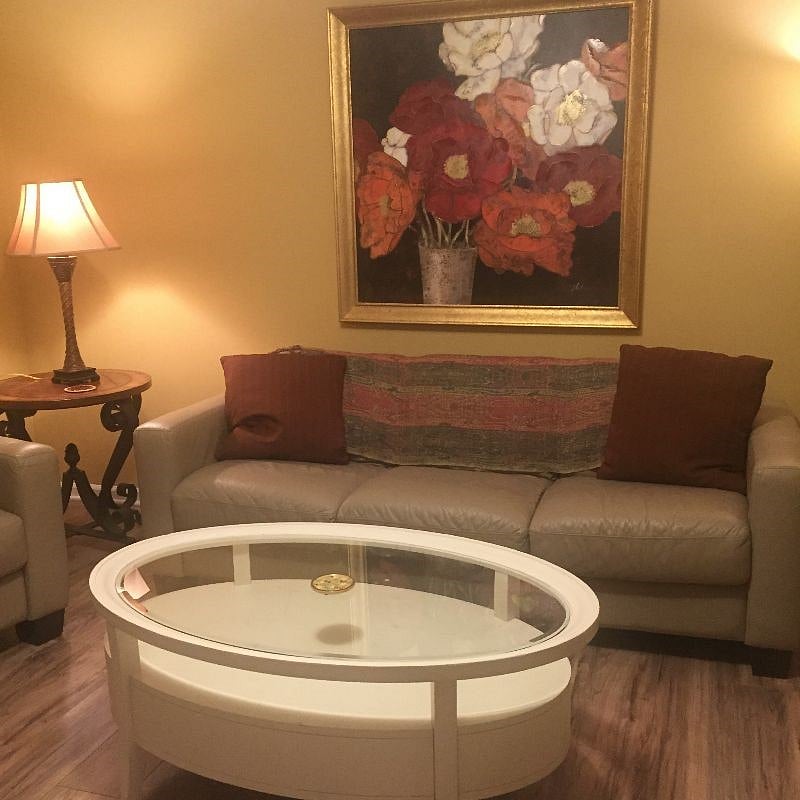Beautiful living room with bright, bold artwork
