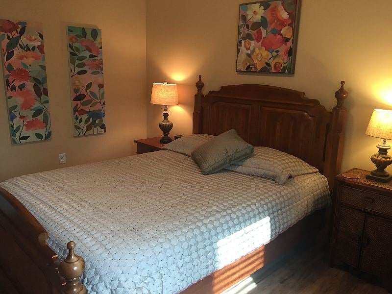 Bright happy artwork in queen bedroom