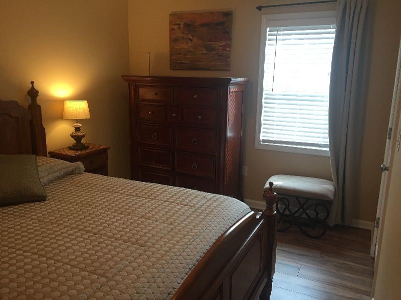 Lovely quality furniture in cozy queen bedroom
