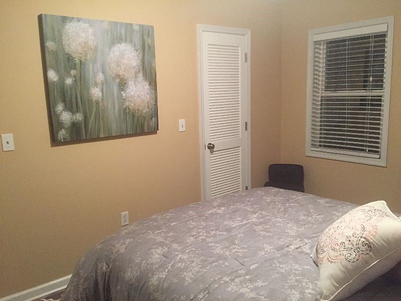 Peaceful dreams dandelion artwork and walk-in closet with full length mirror, hangers supplied on long rod and long shelf for lots of storage space.