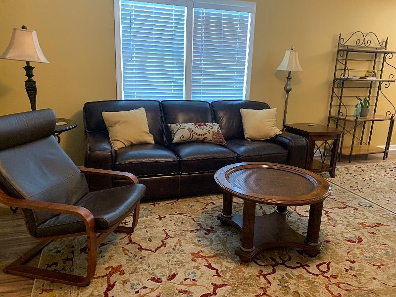 Comfortable leather sofa and Poang chair.