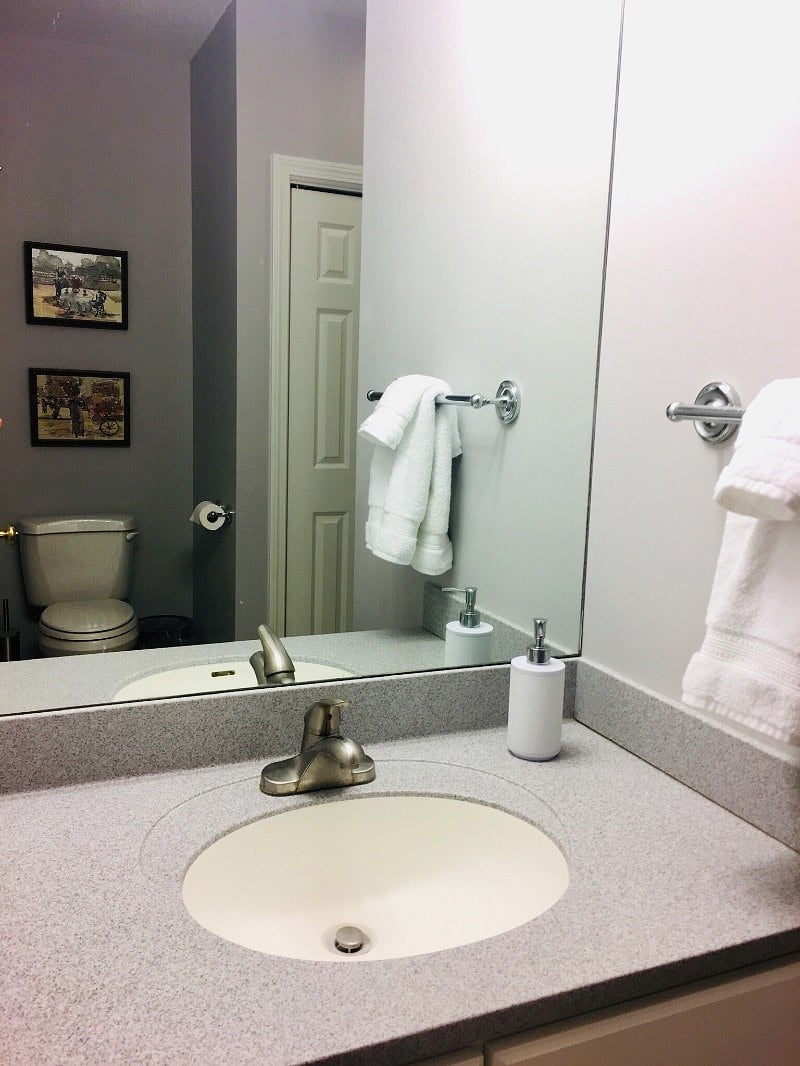 Full size Bathroom with shower and storage.