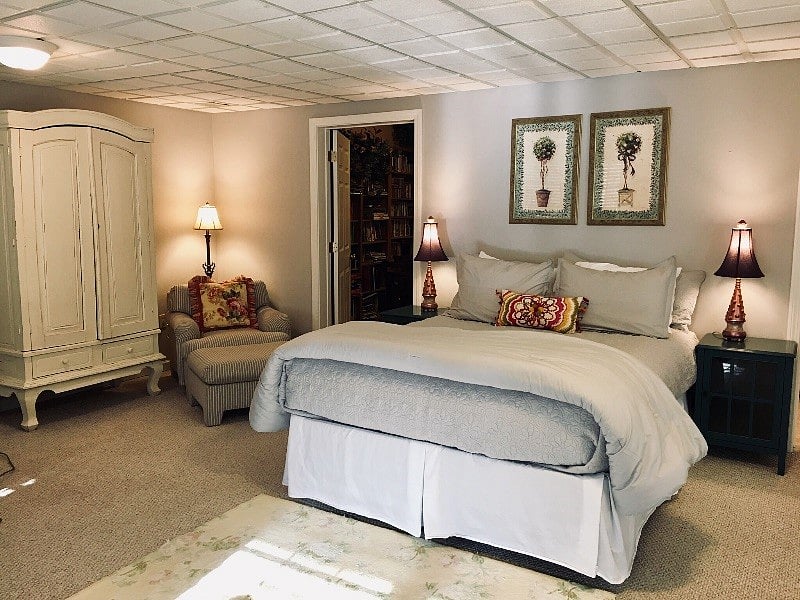 Spacious Bedroom features a queen size bed. Dresser and armoire cabinet for storage.