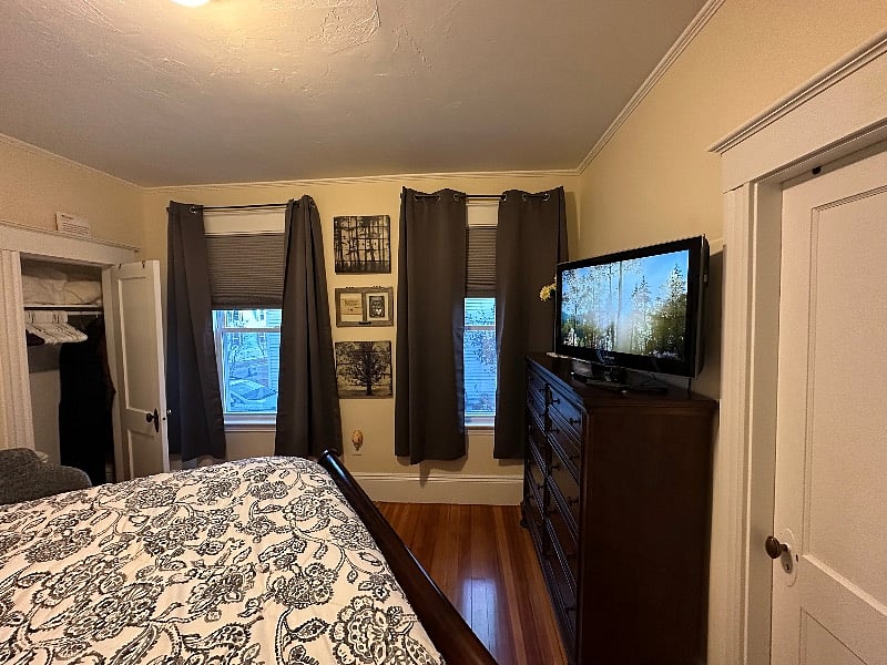 Blackout curtains and with also cellular blackout shades with light block side panels.