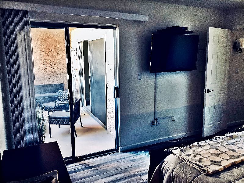 Bedroom with entrance to private balcony