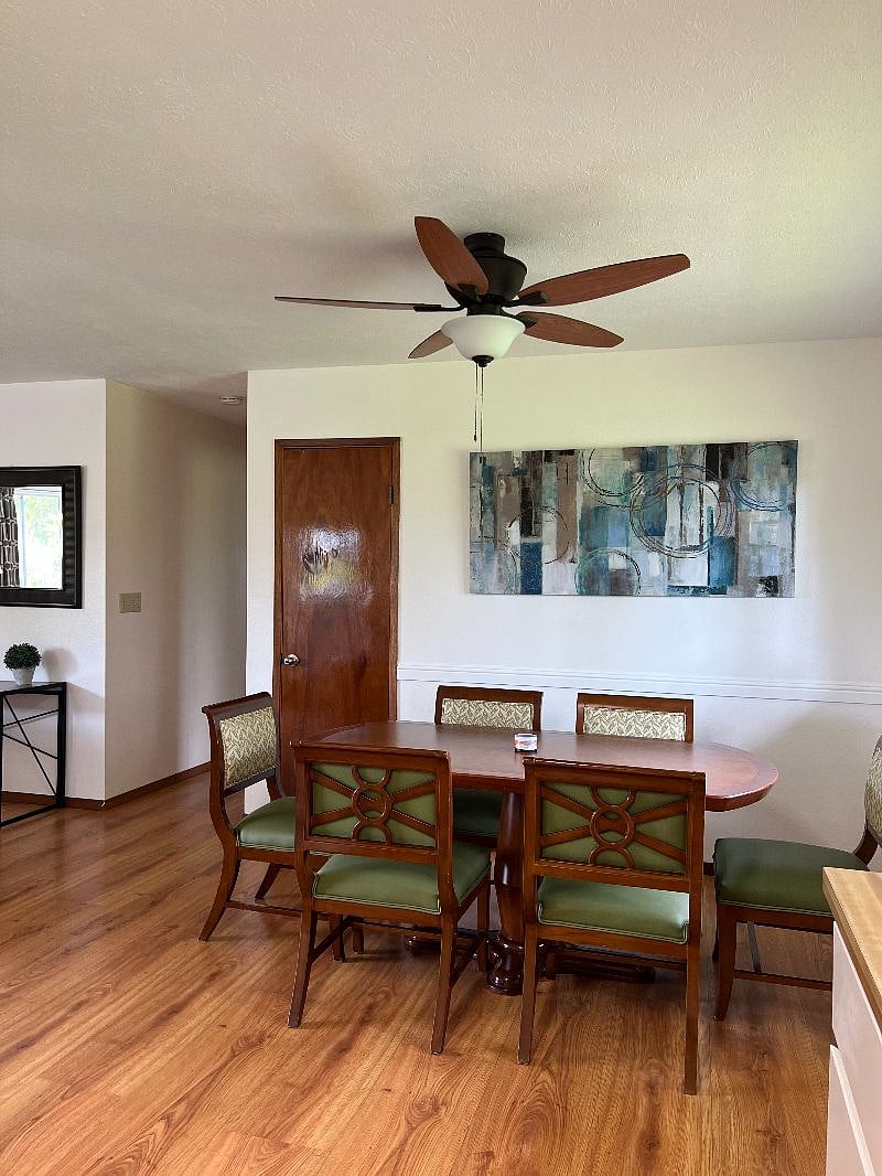 Dining room with new table and 6-chairs.