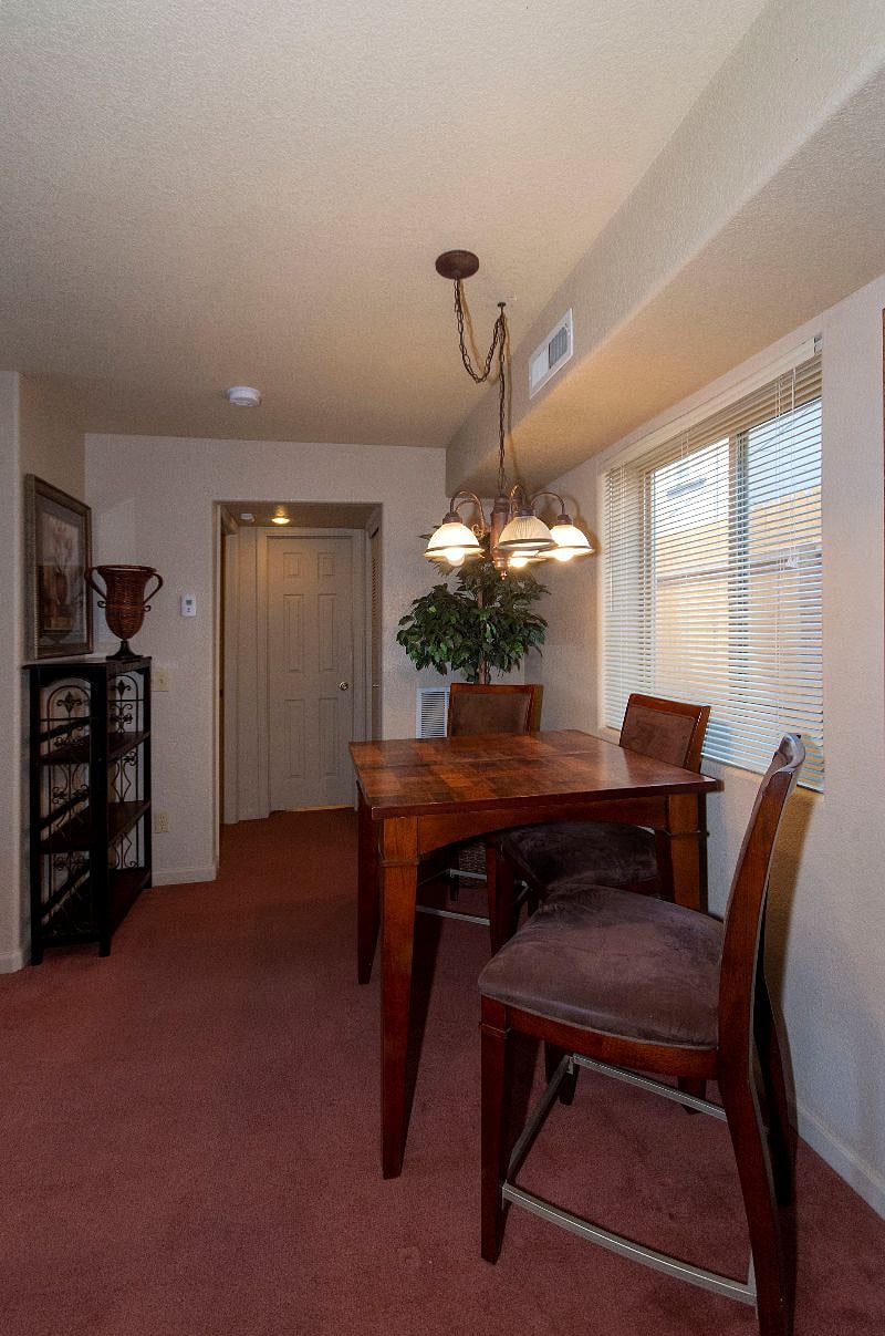Dining Area from Kitchen Looking at Bathroom Door, Bedroom Door to the Left
