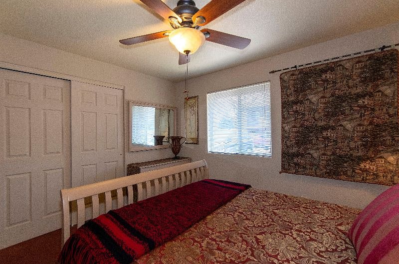 Bedroom with Large Closet and Chest with Mirror