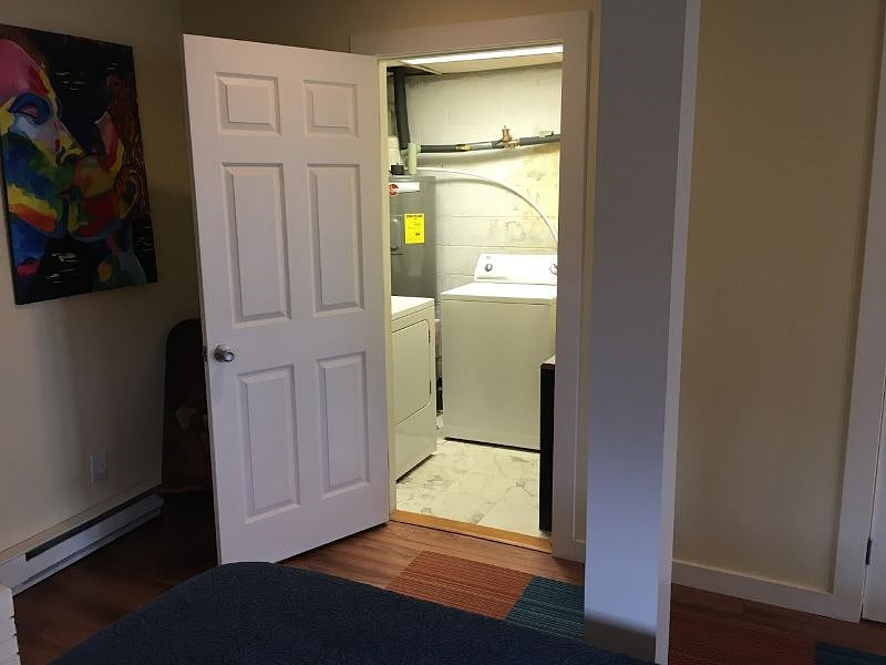 Washer and dryer room, off of the bed area