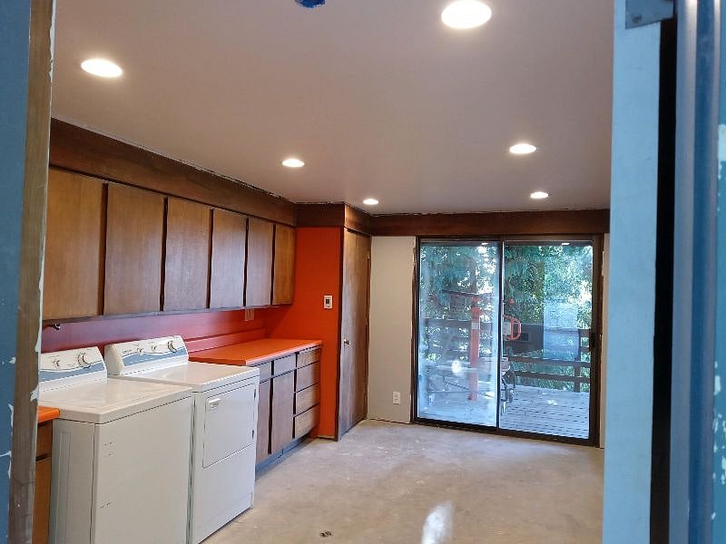 Huge laundry room with sink and room for your suitcases and bikes. 