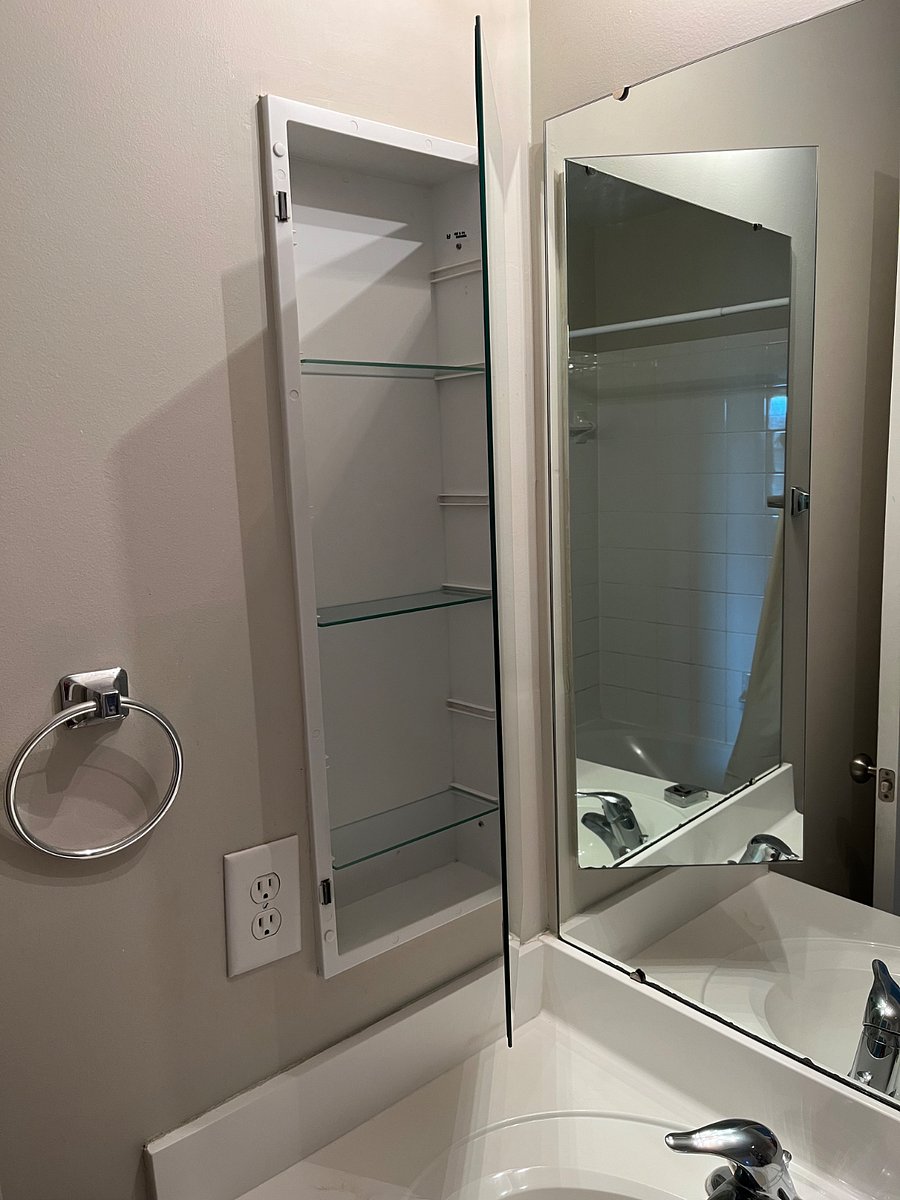 Full size bath tub and shower.