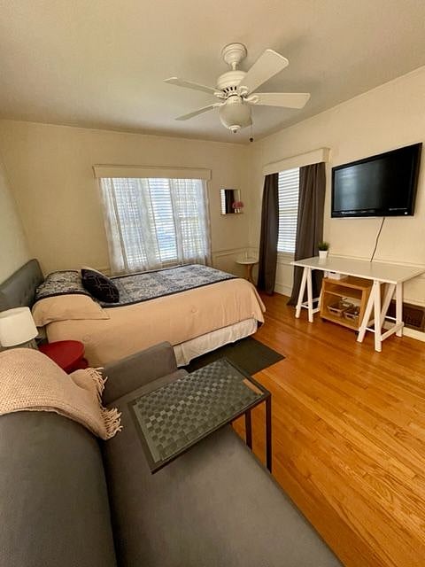 Bedroom w/Mounted TV, and Desk