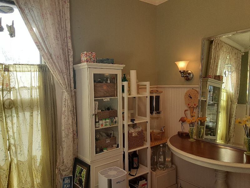 Upstairs shared bath - 4 photos shown.  This bath also offers a filtered water stand in the corner as shown. There is also a small ironing board if needed.